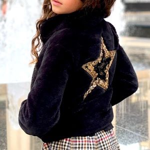 Imoga Black Faux Fur Coat with Gold and Black Sequin Star Appliqué on back.